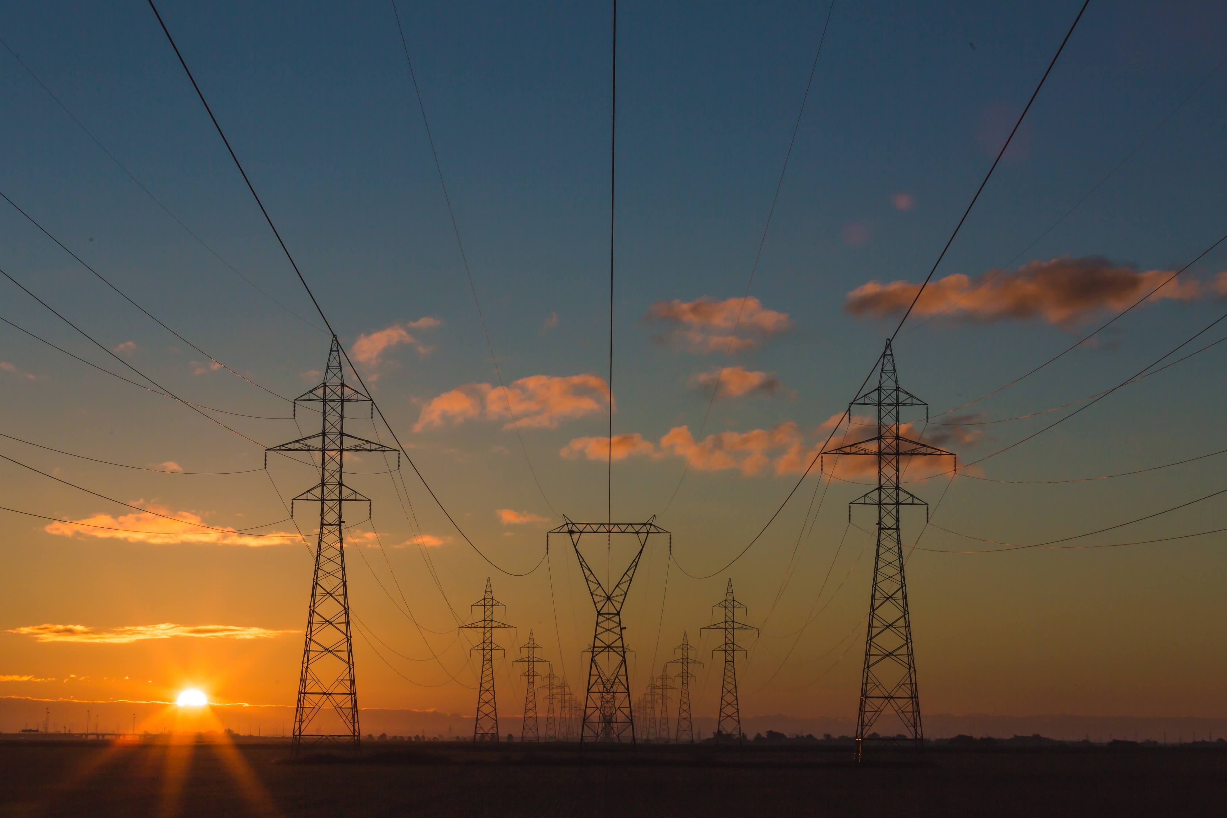 Picture of transmission lines and power towers at sunset