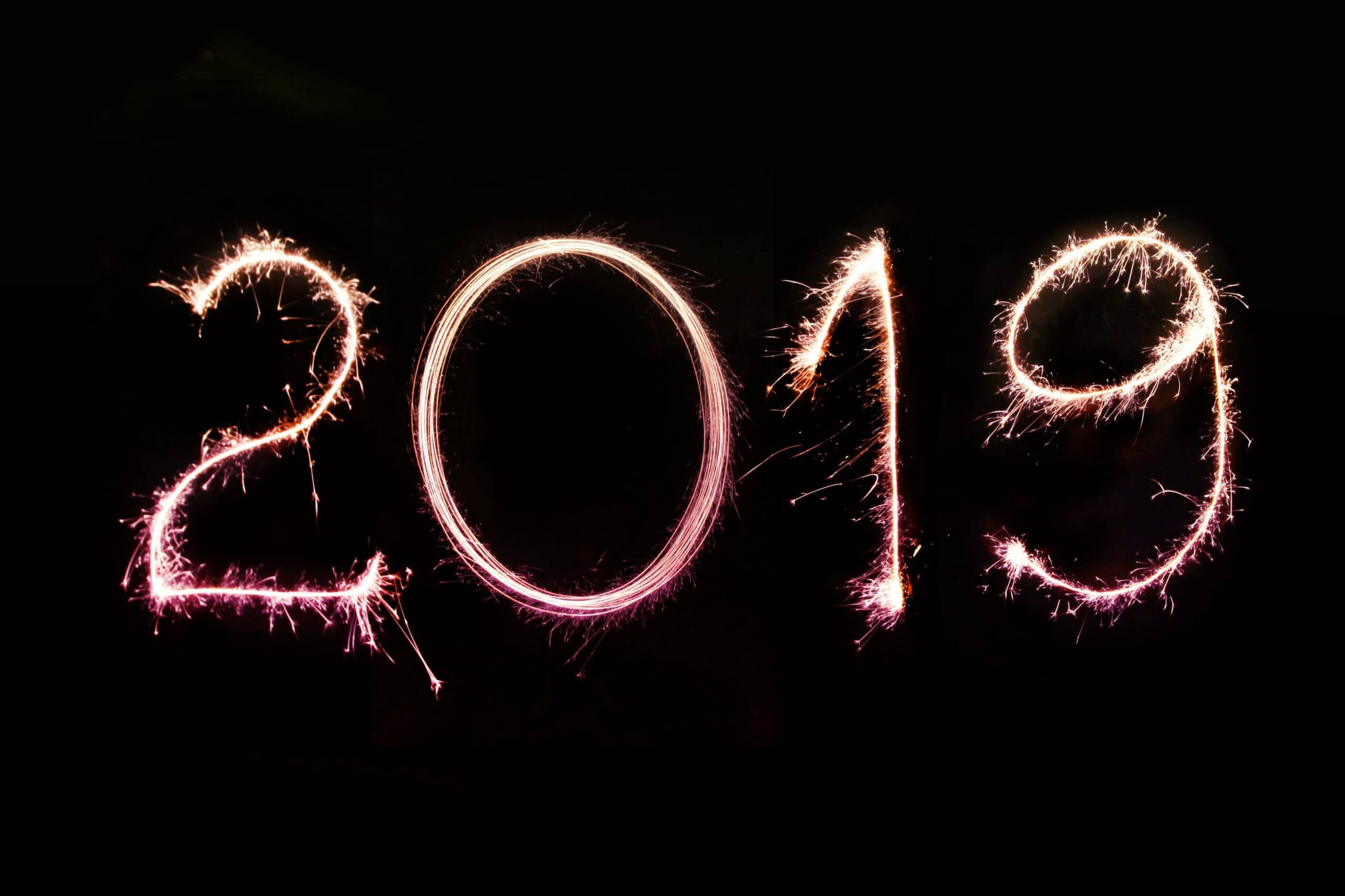 Black background with “2019” highlighted with a gold sparkler